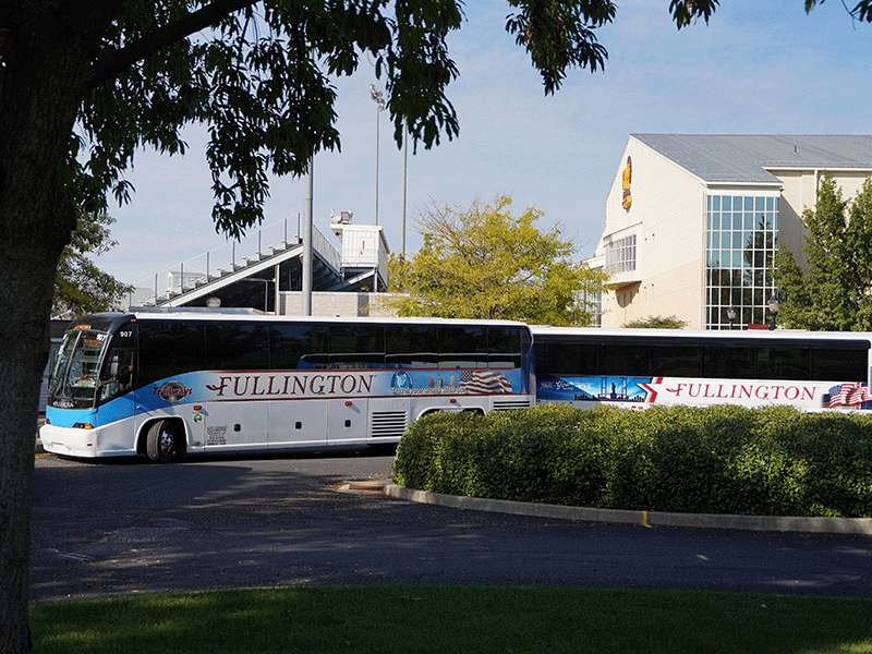 Charter buses leave Milton Hershey School to transport students to their home communities.