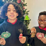 Residents of student home Carousel display the ornaments they made as part of Countdown to Christmas.