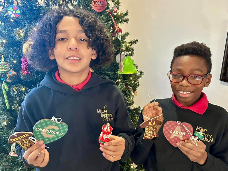 Residents of student home Carousel display the ornaments they made as part of Countdown to Christmas.