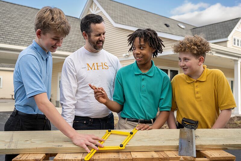 Middle school students learning carpentry
