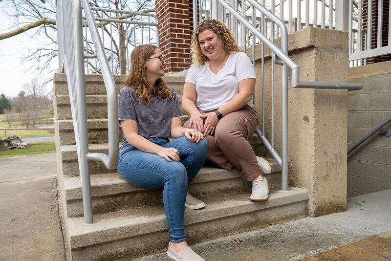 Staff outside of the transitional living buildings