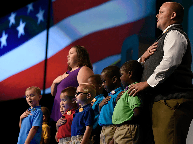 Children and Teachers reciting the pledge of allegiance at Opening of School Assembly 2019.