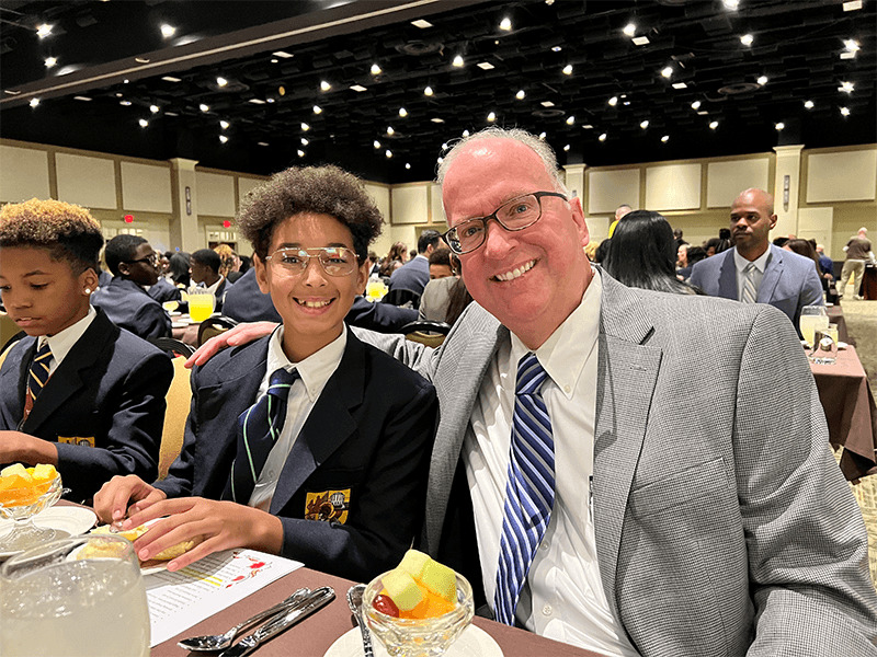 MHS President Pete Gurt '85 with a student at Founders Feast.