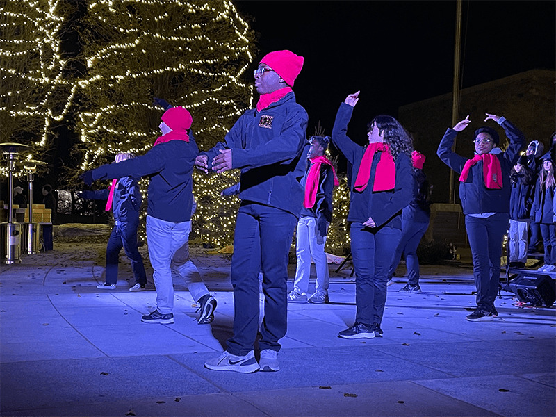 Milton Hershey School students perform in front of Founders Hall for the holidays.