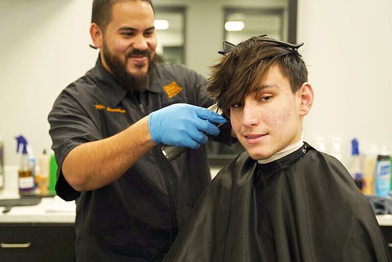 Milton Hershey School hair stylist with student in salon