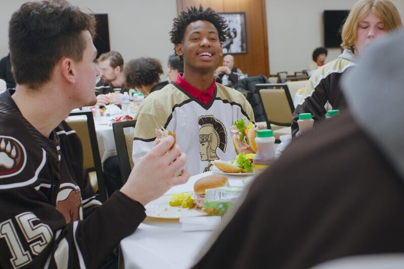 Hershey Bears support Milton Hershey School students by eating lunch with them in Founders Hall.