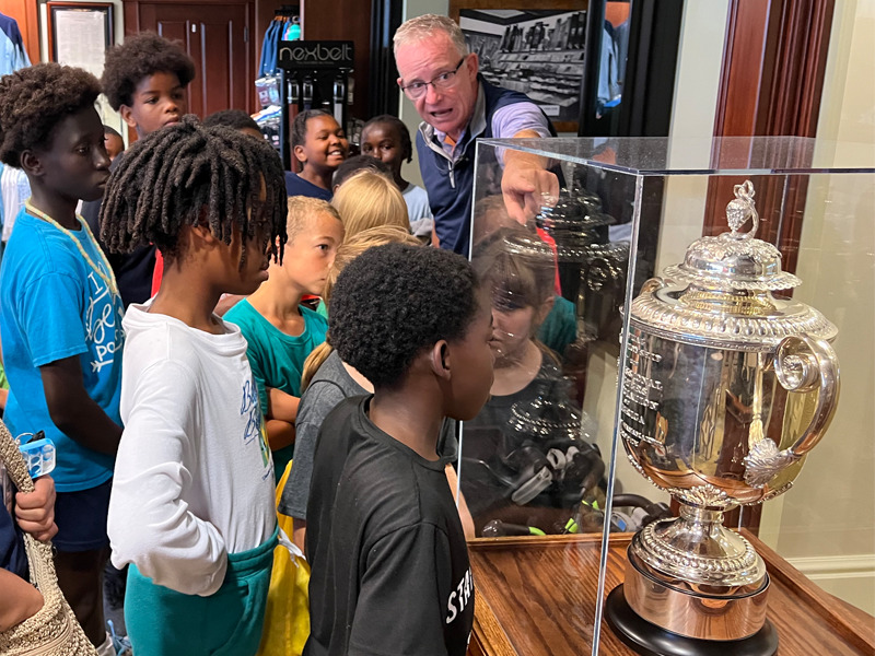 Milton Hershey School students view the trophy from the 1940 PGA Championship.