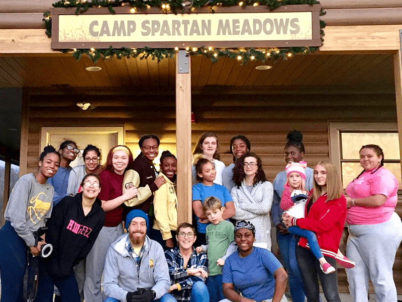 Milton Hershey School students gather outside of Camp Spartan Meadows.