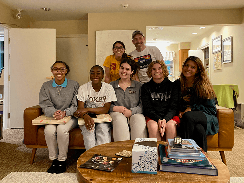 Ashley and Joe celebrate with members of the Milton Hershey School Class of 2022 that lived in their student home.
