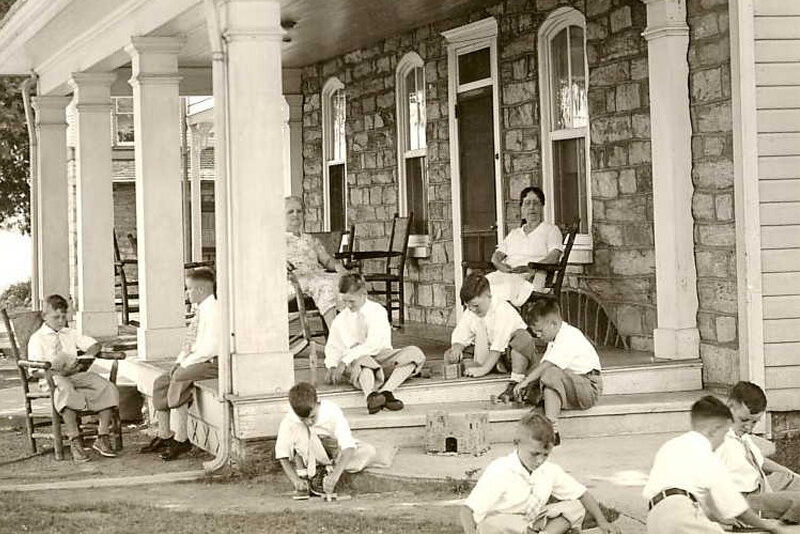 Houseparents at Milton Hershey School watch over children in the school's early days.