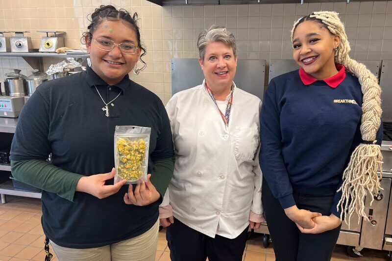 Milton Hershey School Culinary Arts Teacher Samantha Katzman, center, and senior students Felisita Vasquez and Zhawna Freeland.
