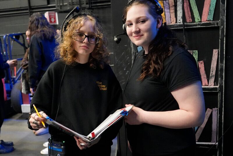 Stage Managers Mecca Stever and Helena Kalbach work behind the scenes during Milton Hershey School's production of "Matilda."