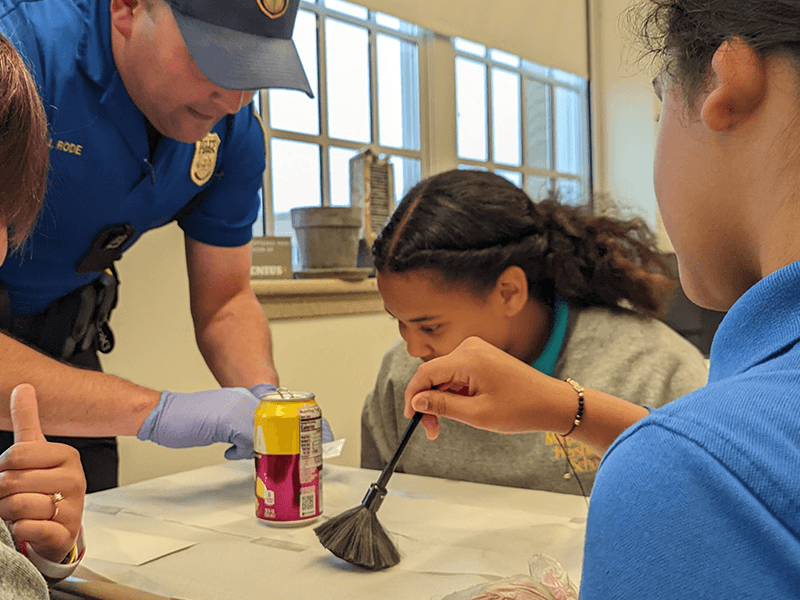 Milton Hershey School Middle Division students learn about the art of finding a fingerprint