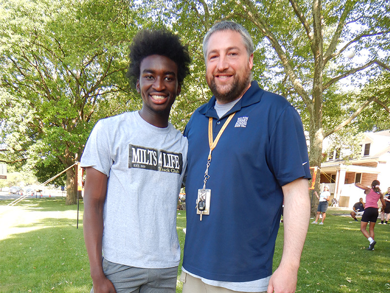 Milton Hershey School student stands with a a college and career counselor.
