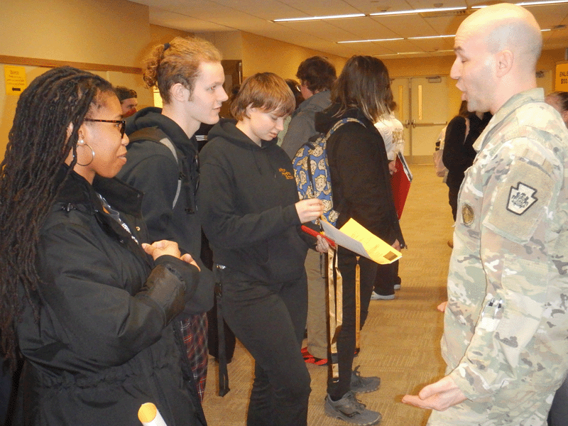 A representative from the United States Army speaks to Milton Hershey School at the postsecondary career fair.