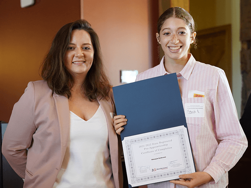 Milton Hershey School student is awarded her pre-apprenticeship certificate.