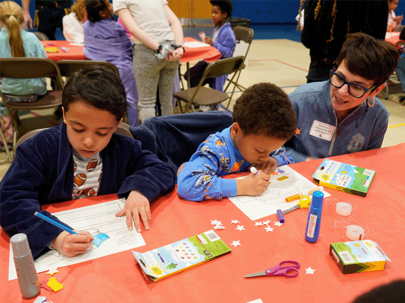 Milton Hershey School students create a craft at Go R.E.D. Reading Night.