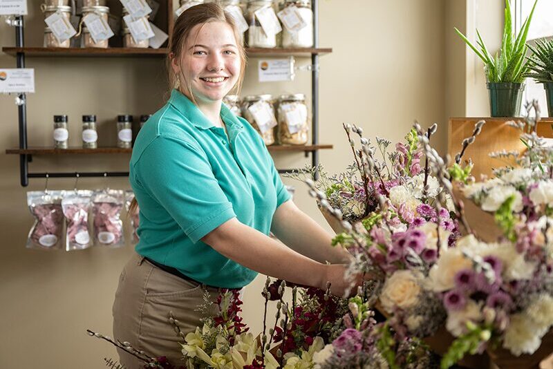 High school student working in the student-run market