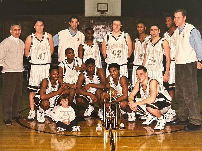 2023 Milton Hershey School Alumnus of the Year Robin Ferrer '00 plays basketball at the school.