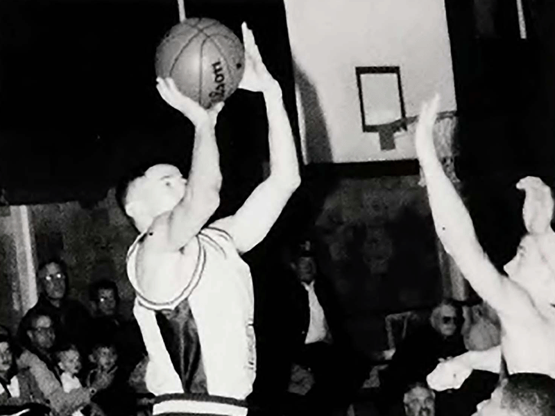 2023 Milton Hershey School Alumnus of the Year Robin Ferrer '00 plays basketball at the school.