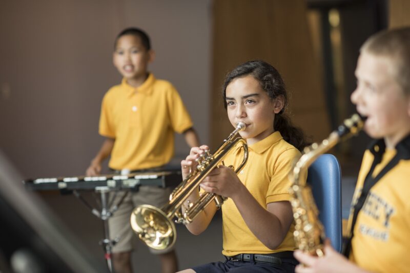 a child playing a trumpet