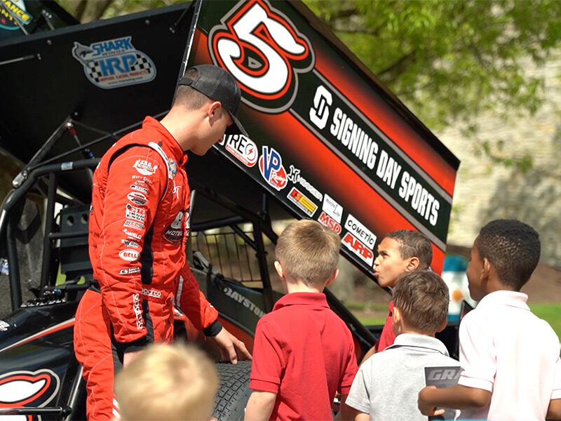 Milton Hershey School students visit with World of Outlaws drivers