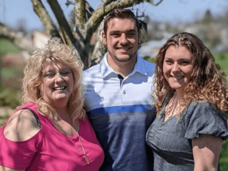 Former Milton Hershey School parent/sponsor with her two children, now MHS graduates.