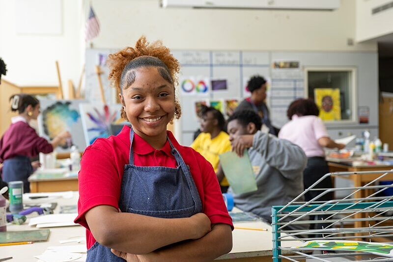 Milton Hershey School student standing in art classroom.