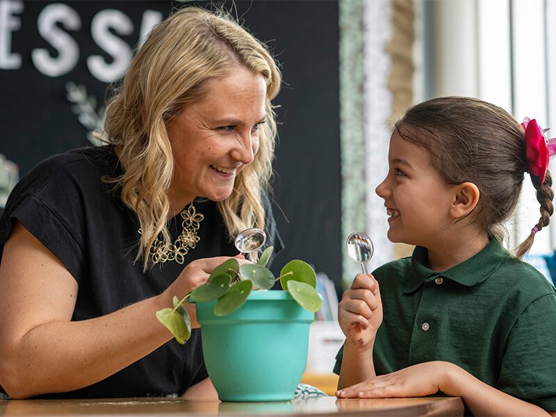 Elementary student with their teacher in the classroom