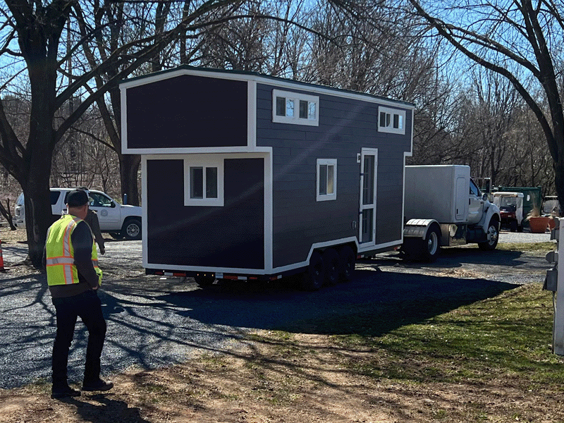 A tiny house built by Milton Hershey School students arrives at Hersheypark Camping Resort.