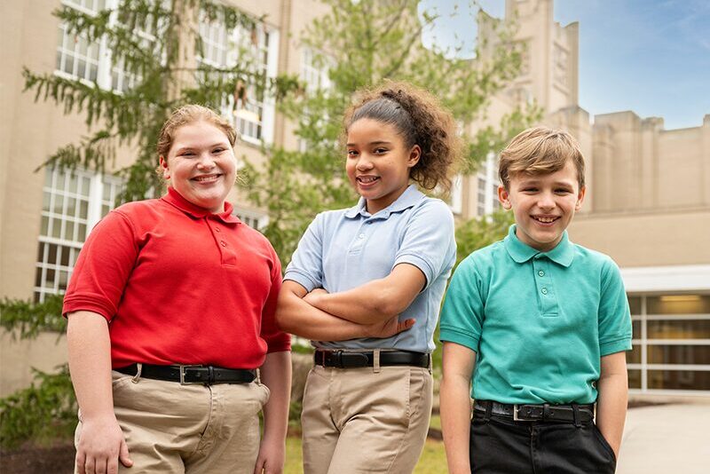 Middle school students outside school building