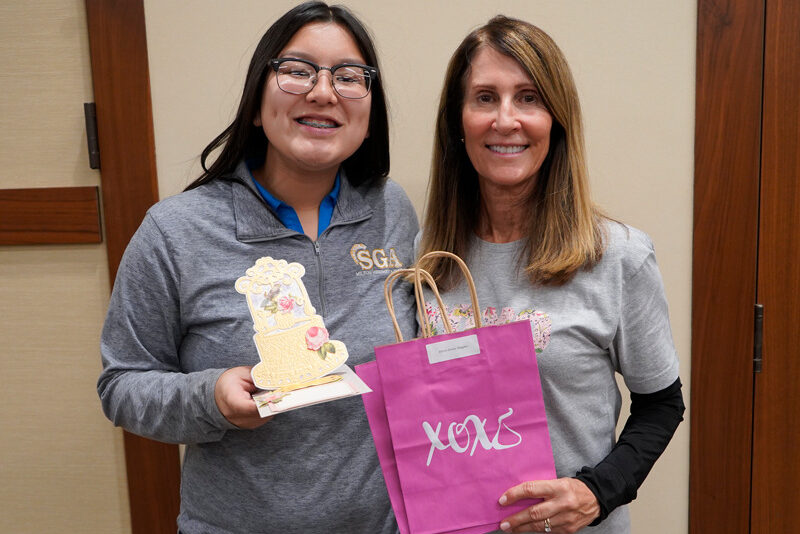 Milton Hershey School student Stacey Vo and Mrs. Jane Gurt show gifts they made for World Kindness Day.