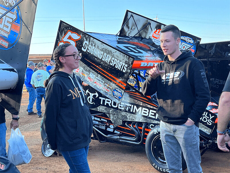 Milton Hershey School student with World of Outlaws team member. 