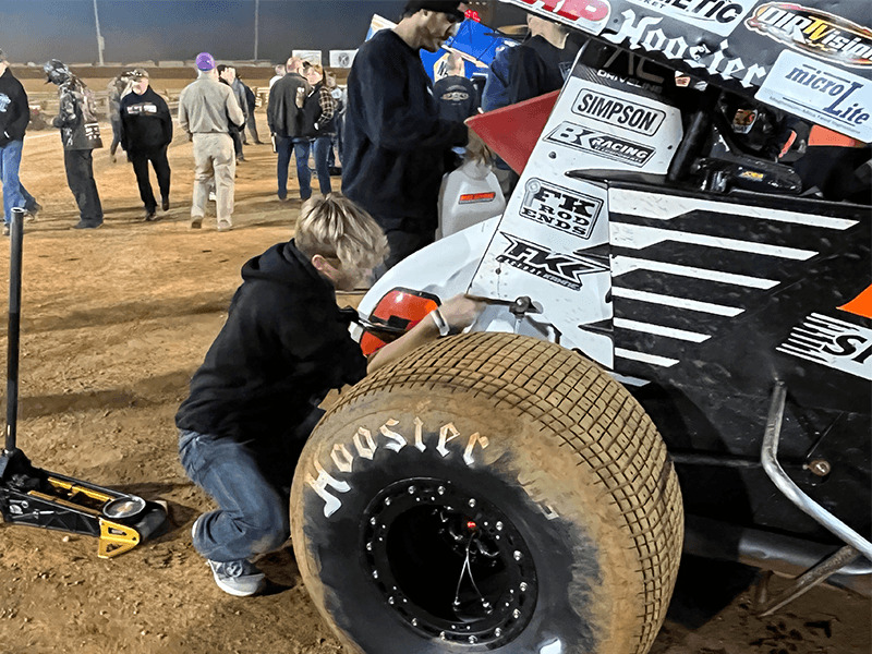 Milton Hershey School student works on World of Outlaws car.