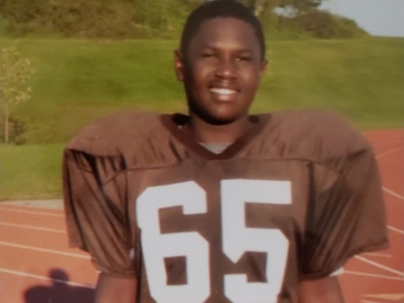 MHS alumnus Xavier Oliver as a student athlete playing football