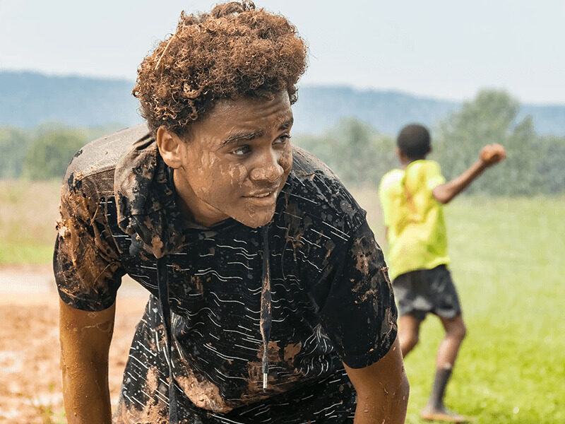 Milton Hershey School students participate in a mud run during YRE.