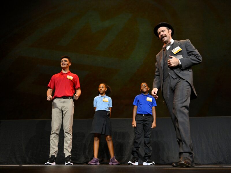 Opening of School Assembly stage with Lebbie and students