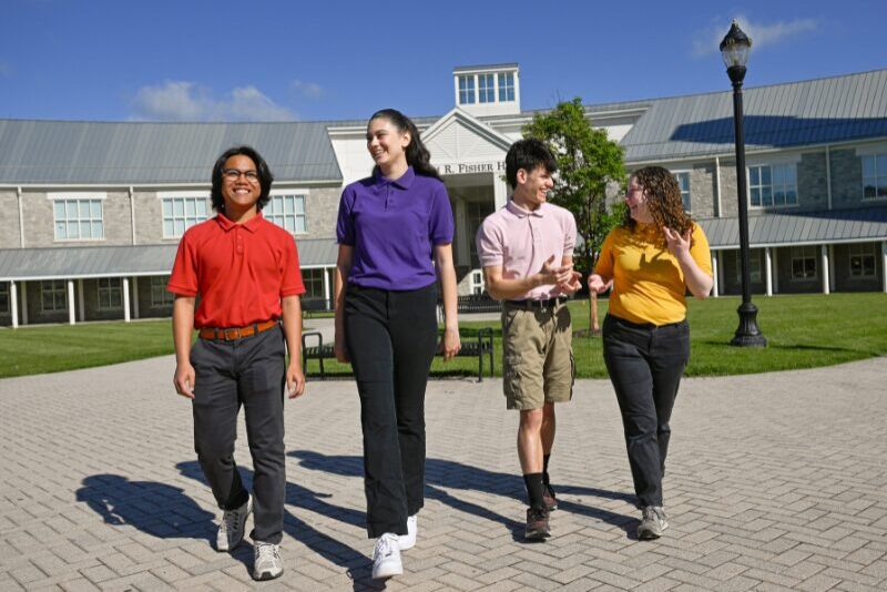 senior division students walking in spartan commons