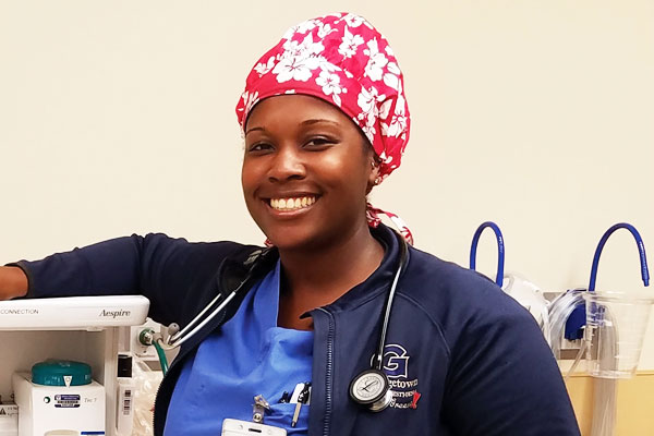 a person wearing a red head wrap