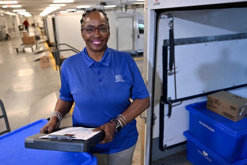 MHS transportation driver loading food into her truck