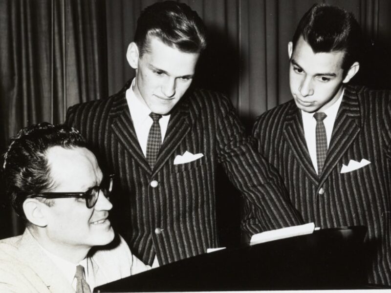 Virgil Alexander playing piano with glee club